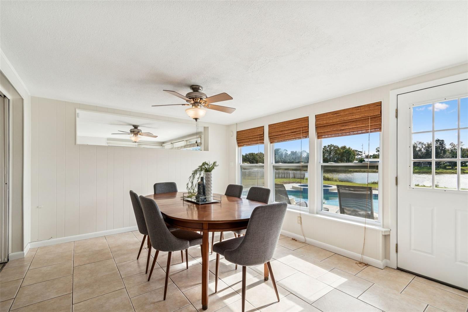 Dedicated dining room overlooking pool and lake