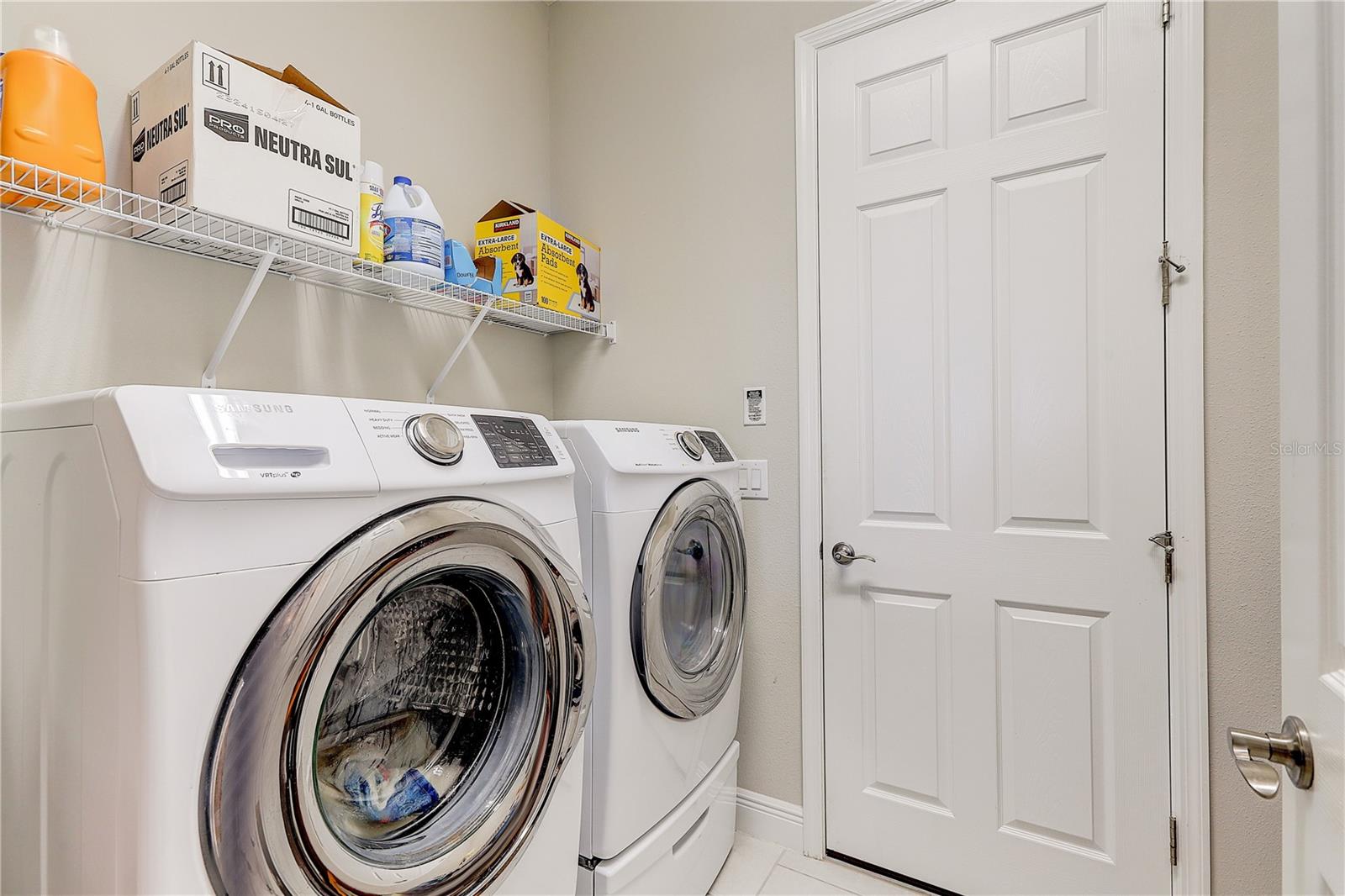 inside laundry room downstairs that leads out to the 3 car garage