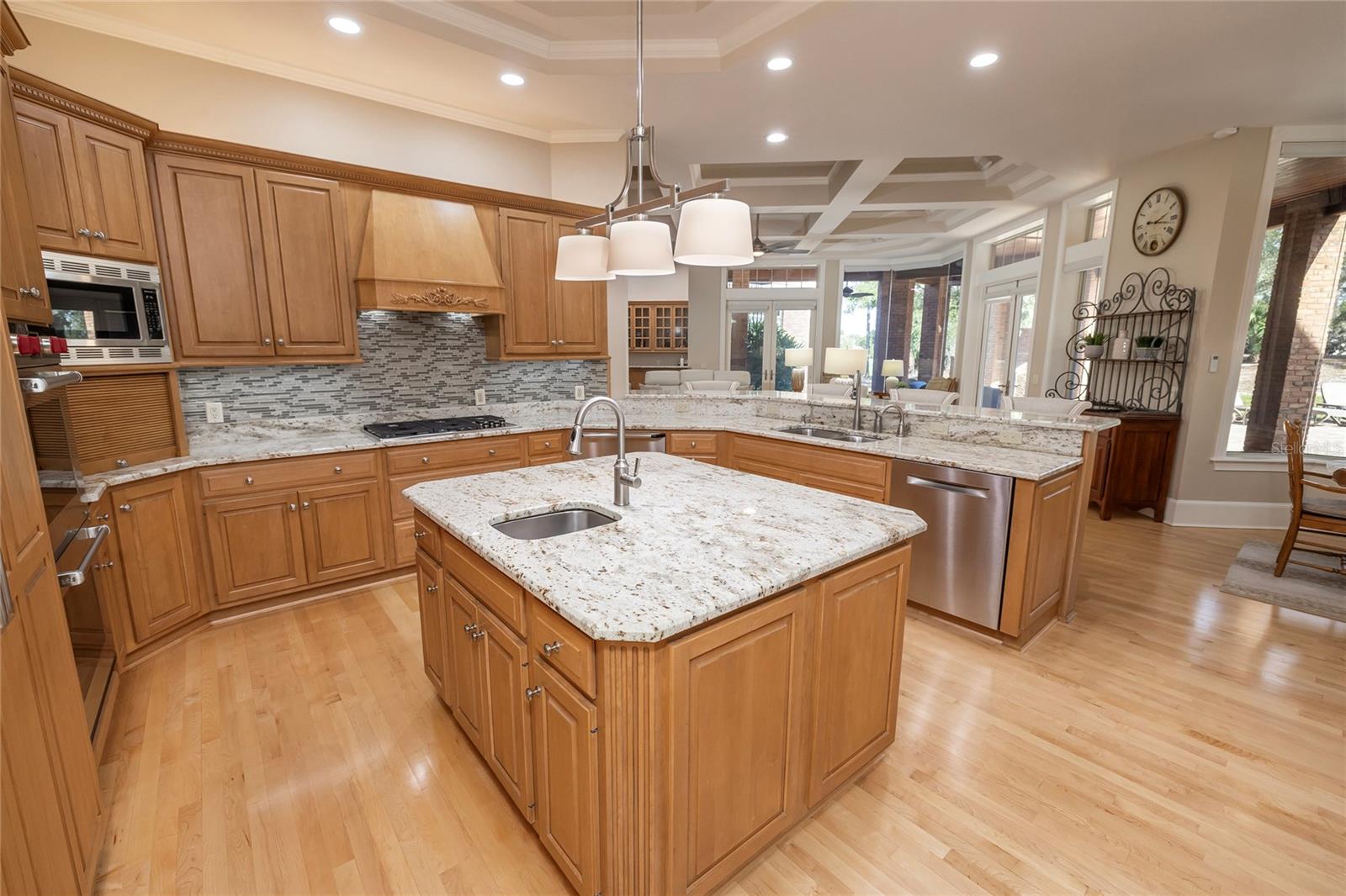 Island kitchen opens to breakfast room and family room.