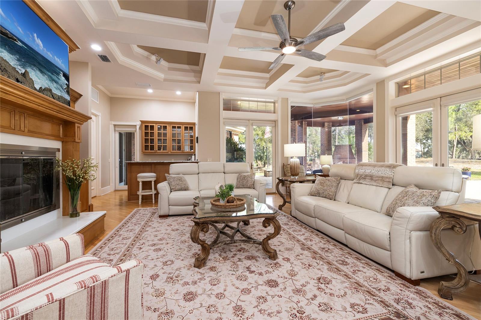 The family room has a natural gas fireplace for staying cozy in the winter months and a wet bar with an ice machine and mini frig.