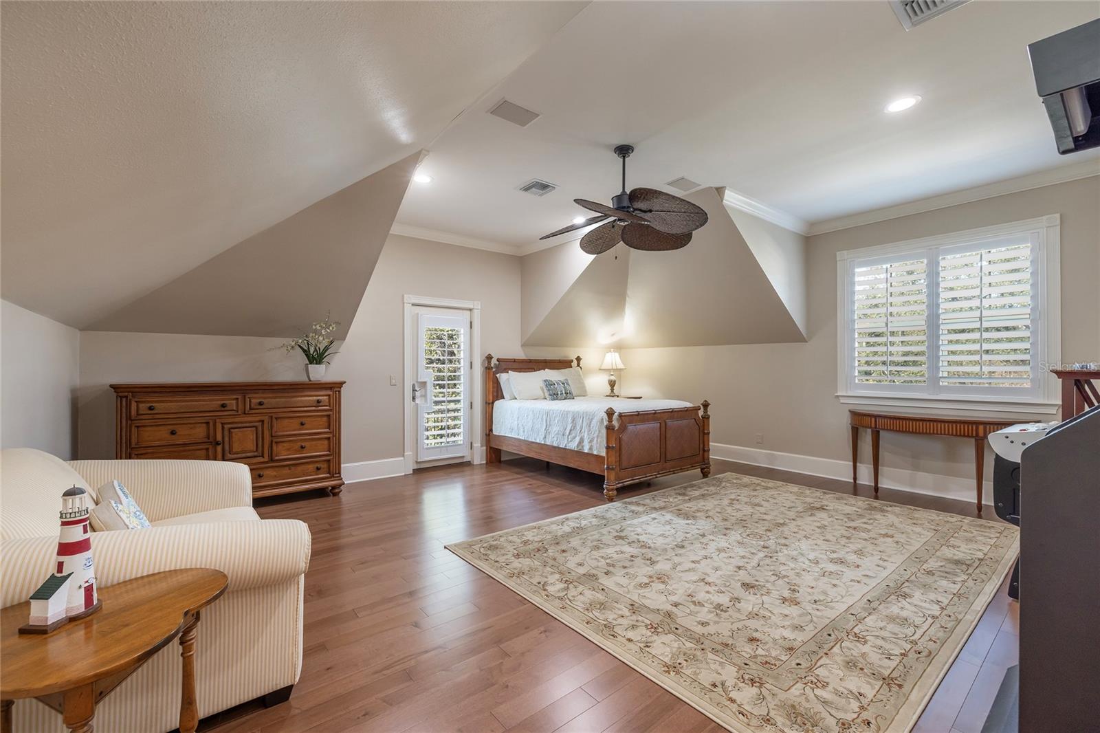 This oversized bedroom with full ensuite bath can also be used as a bonus room. There is an elevator stop at this guest suite. Plantation shutters.