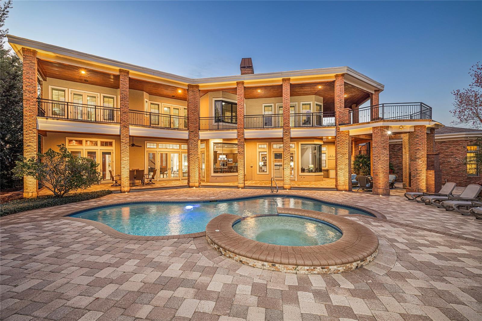 Outdoor lighting has been added to beautifully illuminate this home. New outdoor light system installed in 2025