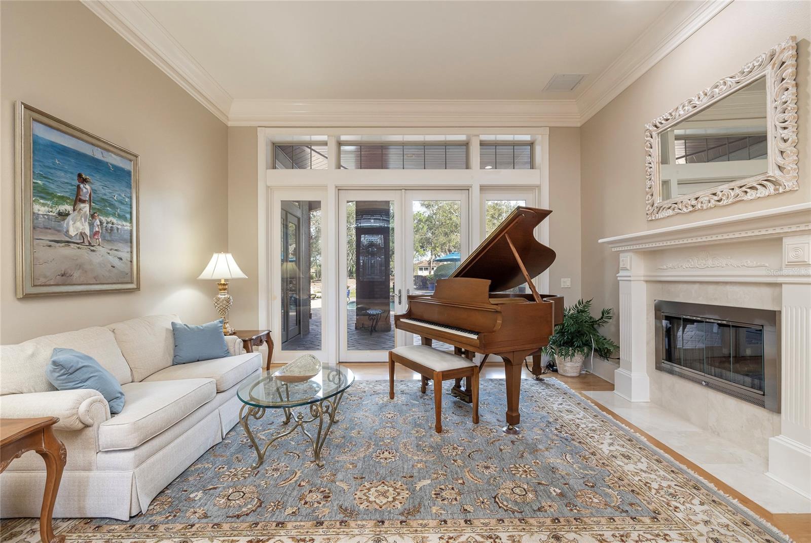 Formal living room shares the two-sided fireplace (no flue) with the office.