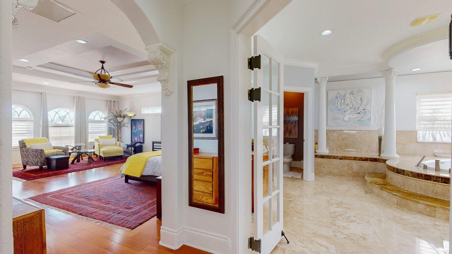 Primary Bedroom with Sitting Room, private balcony overlooking Tampa Bay, En-suite Primary Bathroom with oversized Walk in Closed