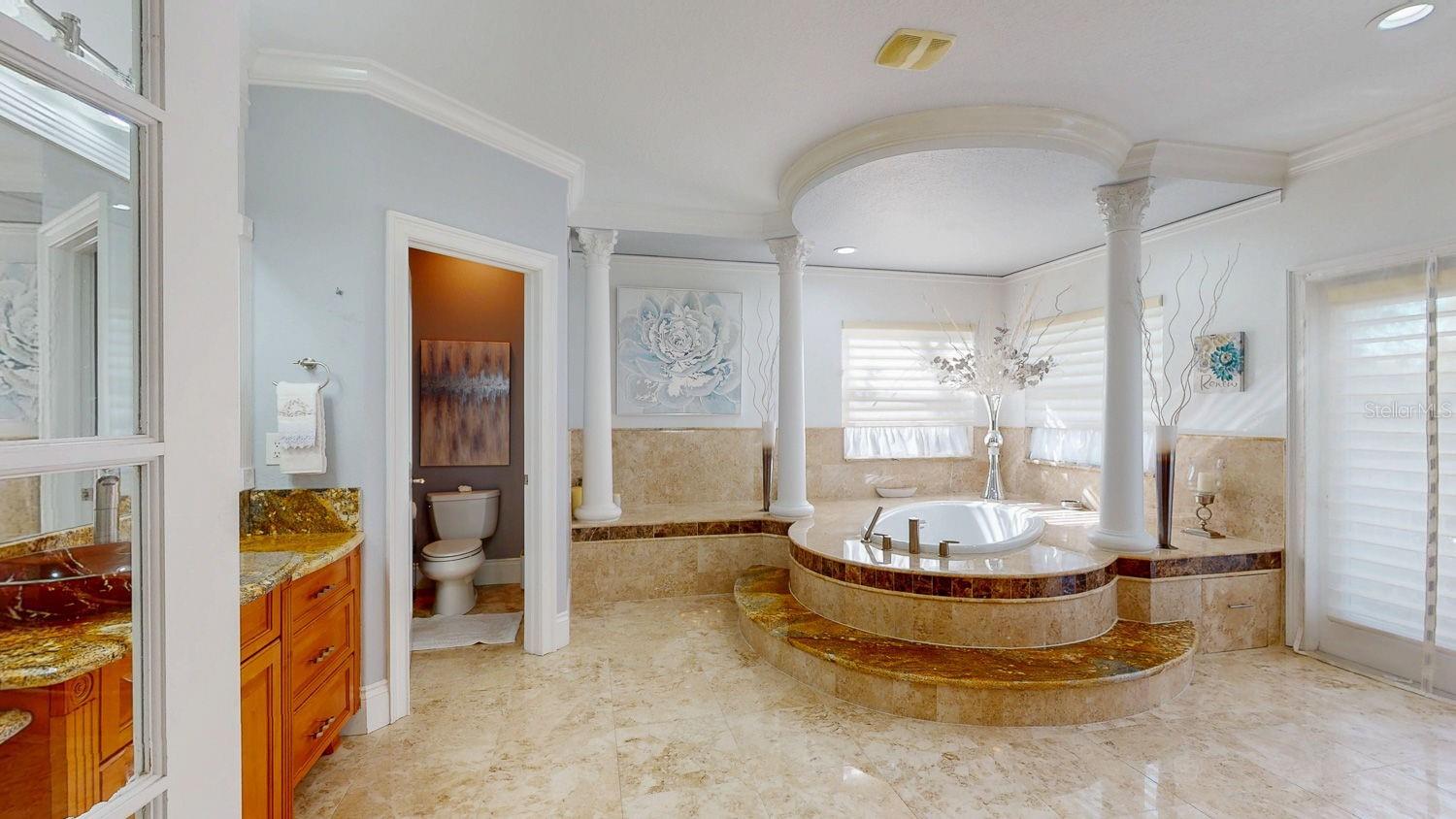 Primary Bedroom with Sitting Room, private balcony overlooking Tampa Bay, En-suite Primary Bathroom with oversized Walk in Closed