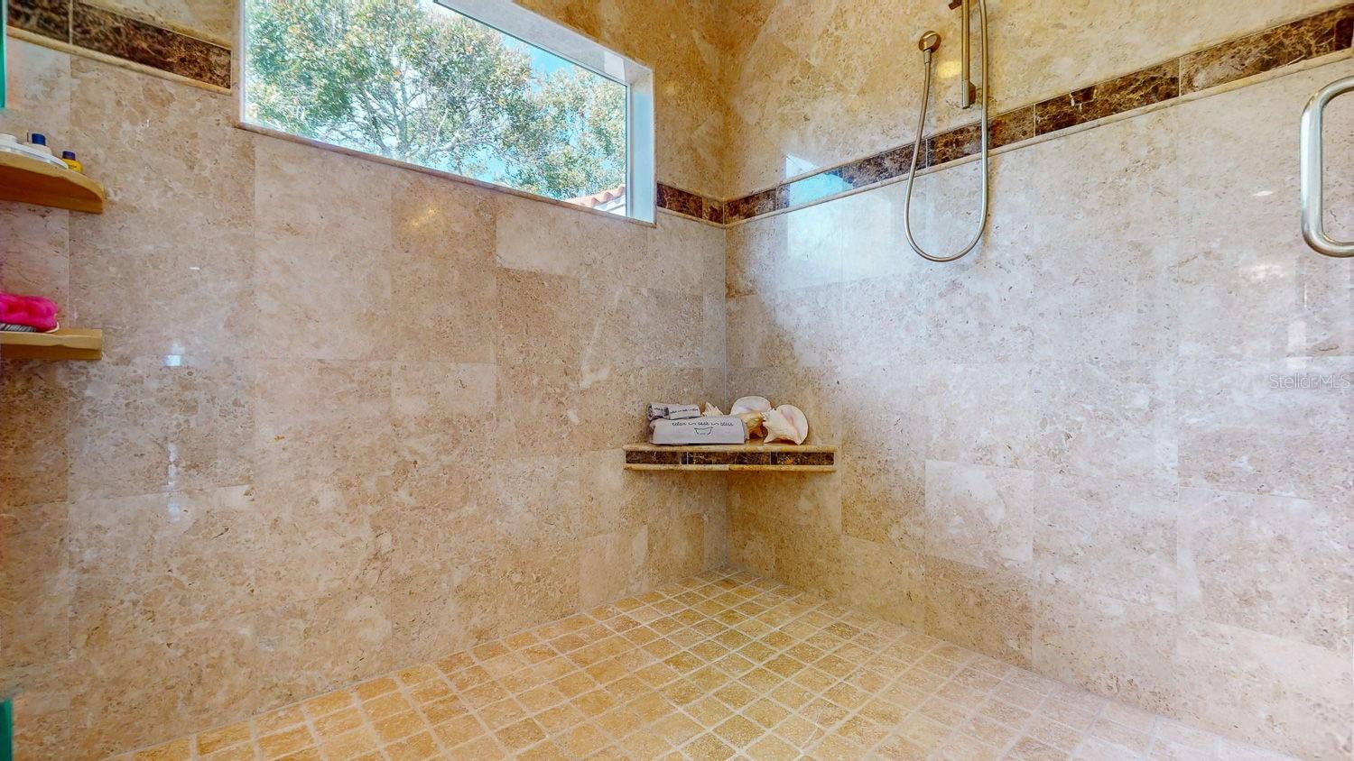 Primary Bedroom with Sitting Room, private balcony overlooking Tampa Bay, En-suite Primary Bathroom with oversized Walk in Closed