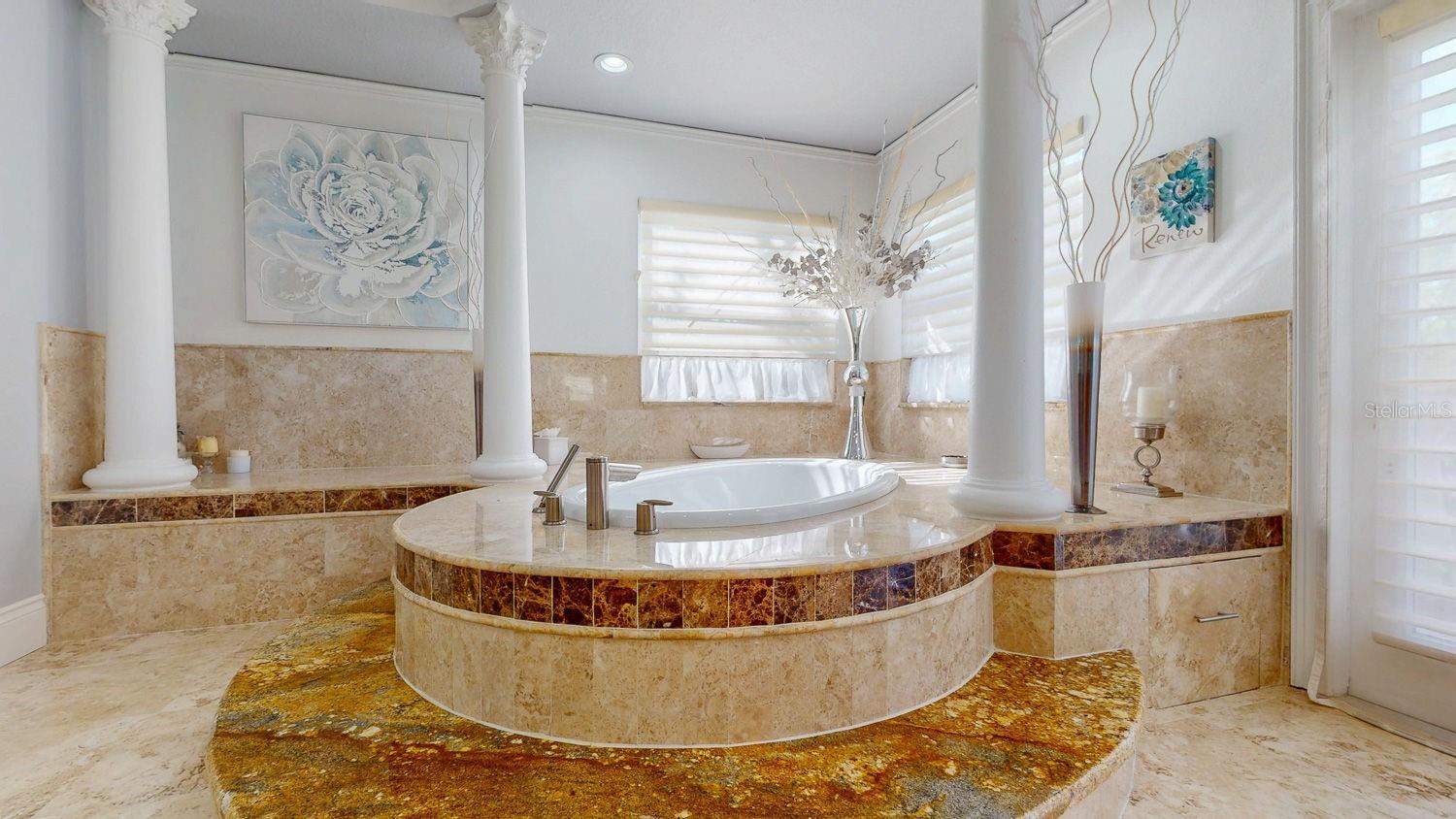 Primary Bedroom with Sitting Room, private balcony overlooking Tampa Bay, En-suite Primary Bathroom with oversized Walk in Closed