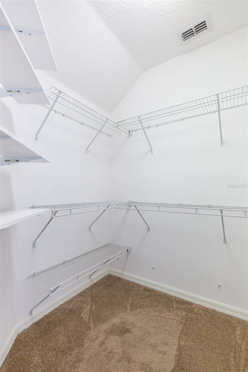 walk in closet in primary bedroom