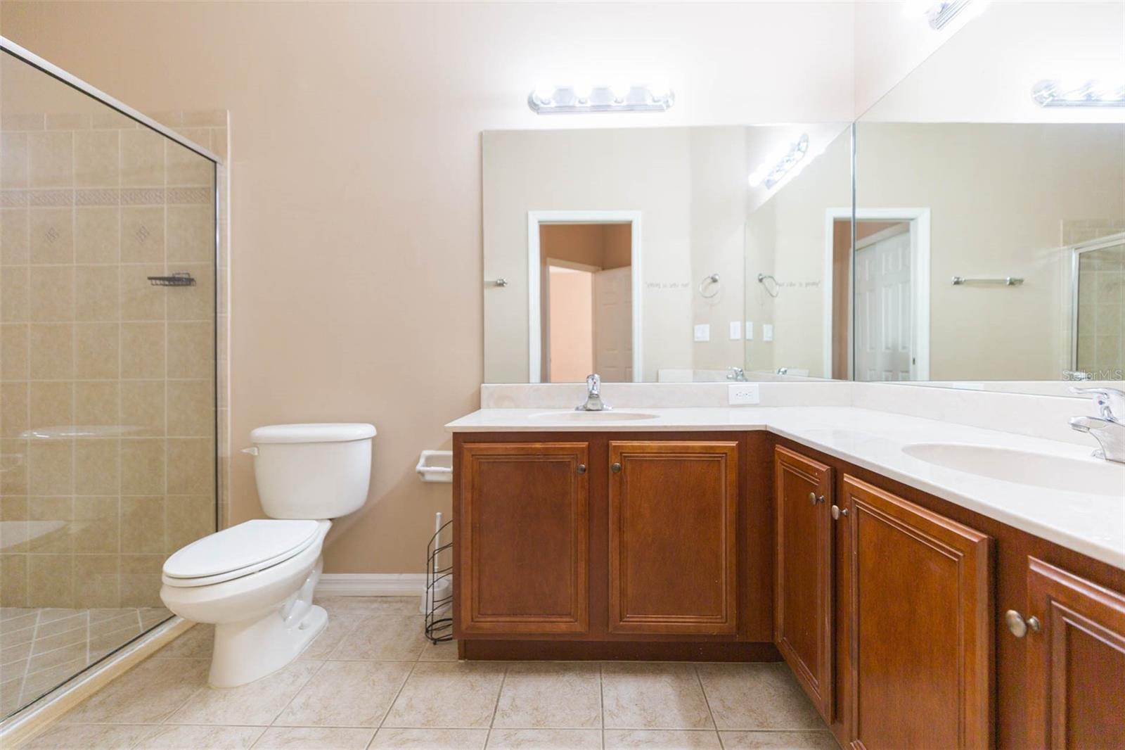 Large en-suite bath with over sized shower and double sinks
