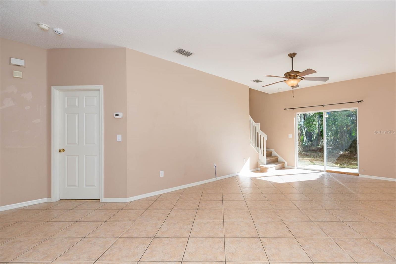 Great Room with door to Primary Suite