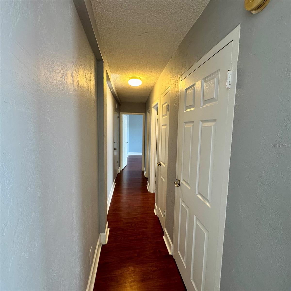 Hallway separates bedrooms from living area