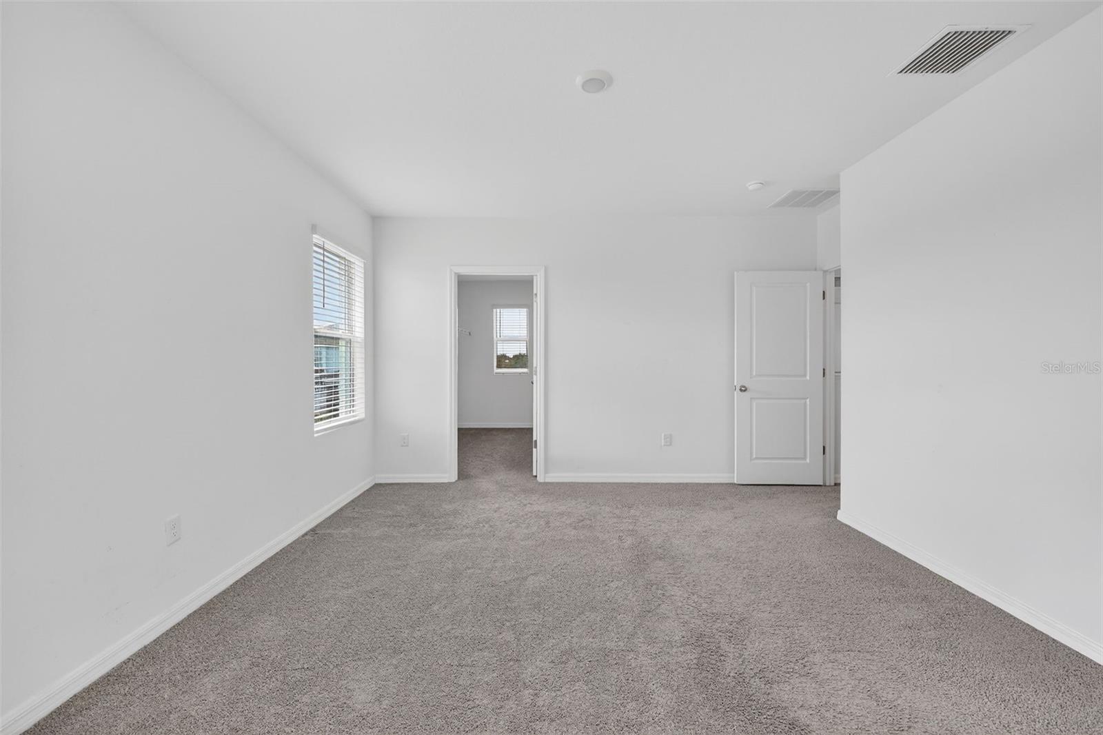 Primary Bedroom with huge walk-in closet.