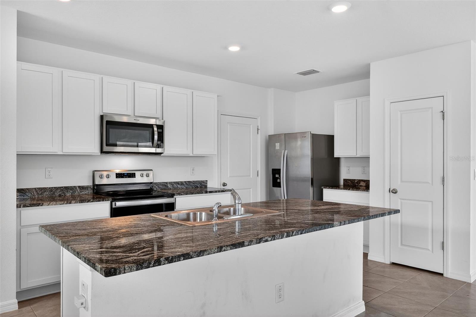 Beautiful White Cabinets, SS Appliances, Granite Countertops and 2 pantries
