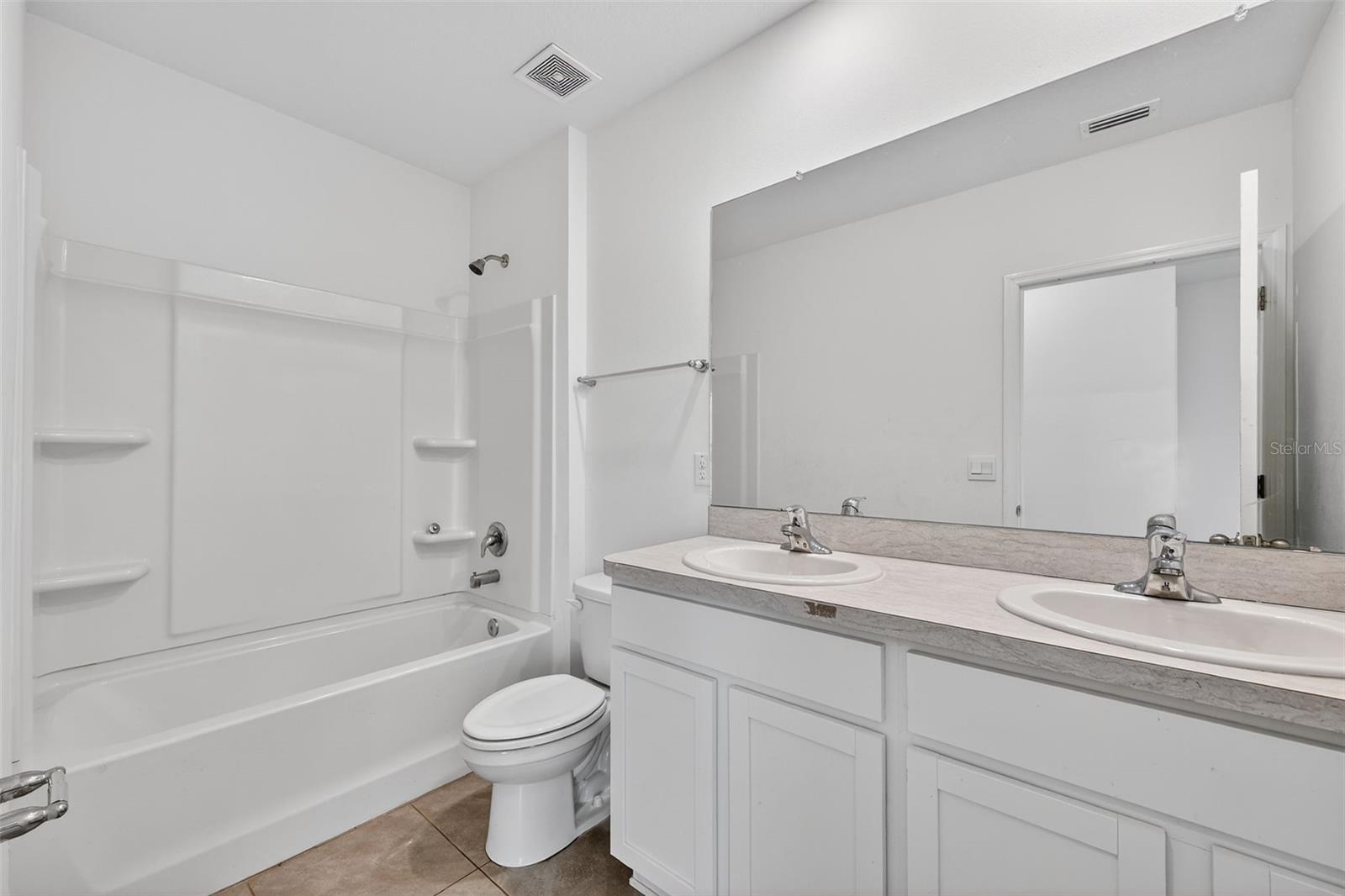 Main Bath with dual vanities and tub/shower