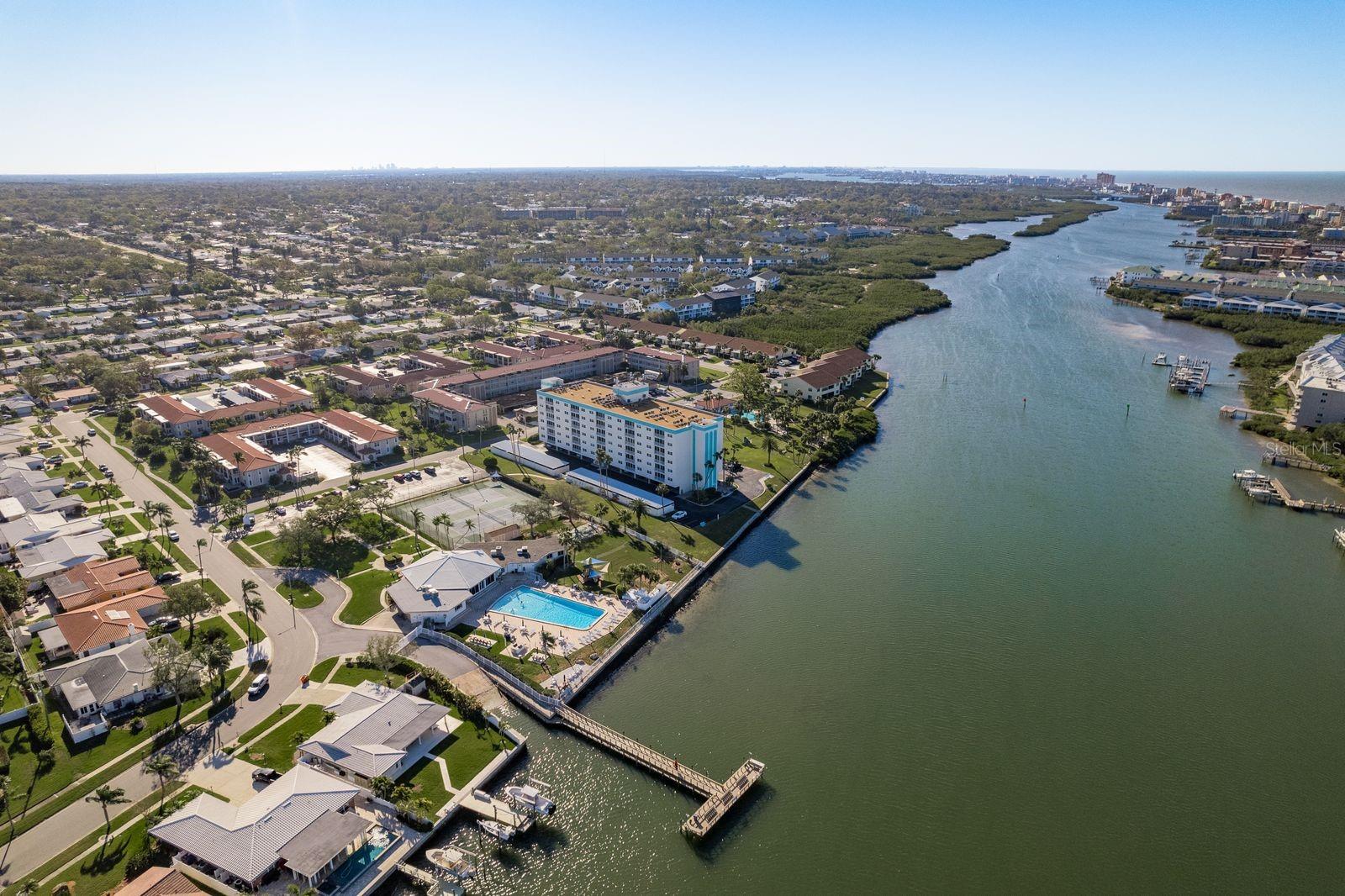 Overview of property looking south, viewing private boat ramp, fishing dock, clubhouse,  tennis courts,