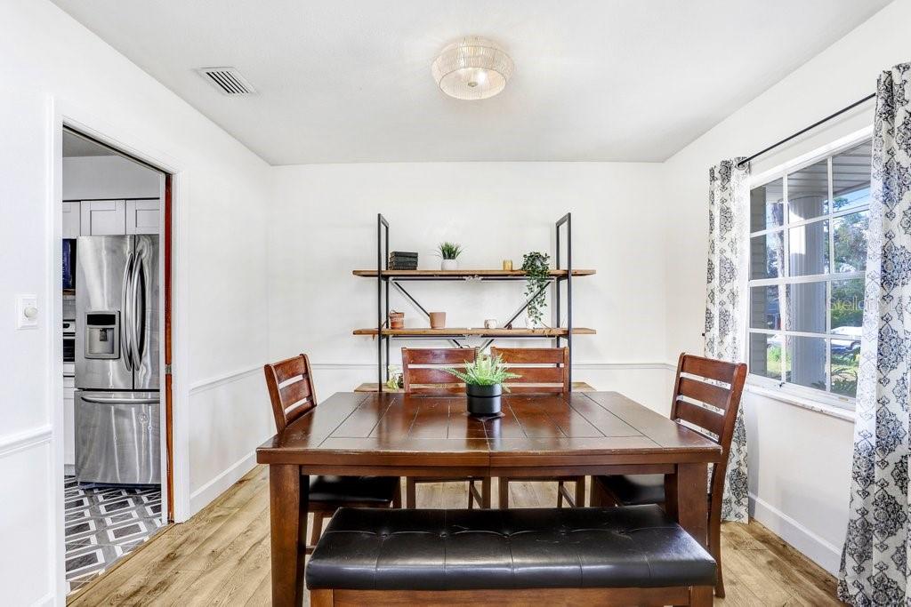 Dining room opens to kitchen and living area for flow and ease of entertaining