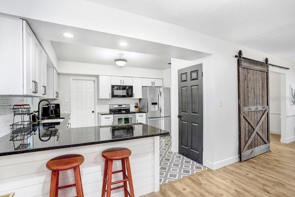 Beautiful updated kitchen with 42" cabinets, granite countertops, Back splash, Mosaic Tile  and stainless appliances,