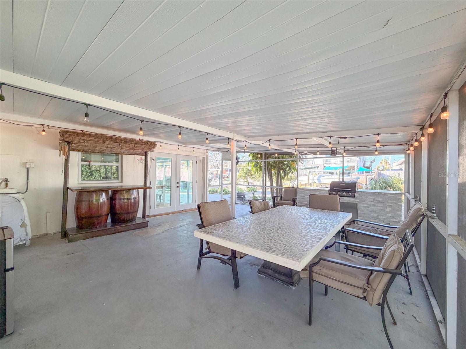 NOW LETS CHECK OUT THIS OUTDOOR SCREENED PORCH!