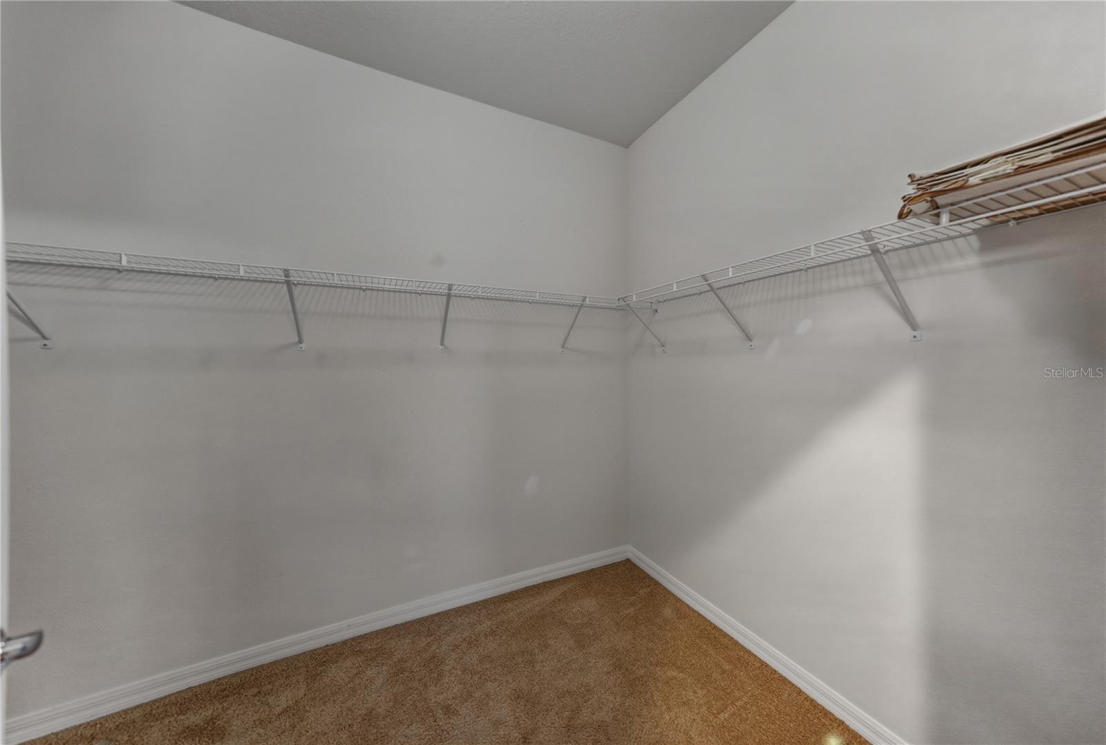 1 of 2 large primary bedroom closets
