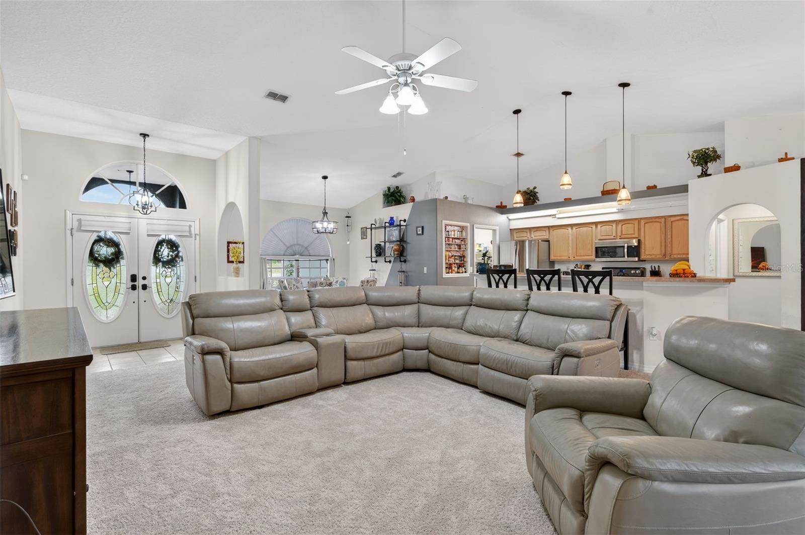 Living Room looking toward front doors, Dinning Room, and Kitchen