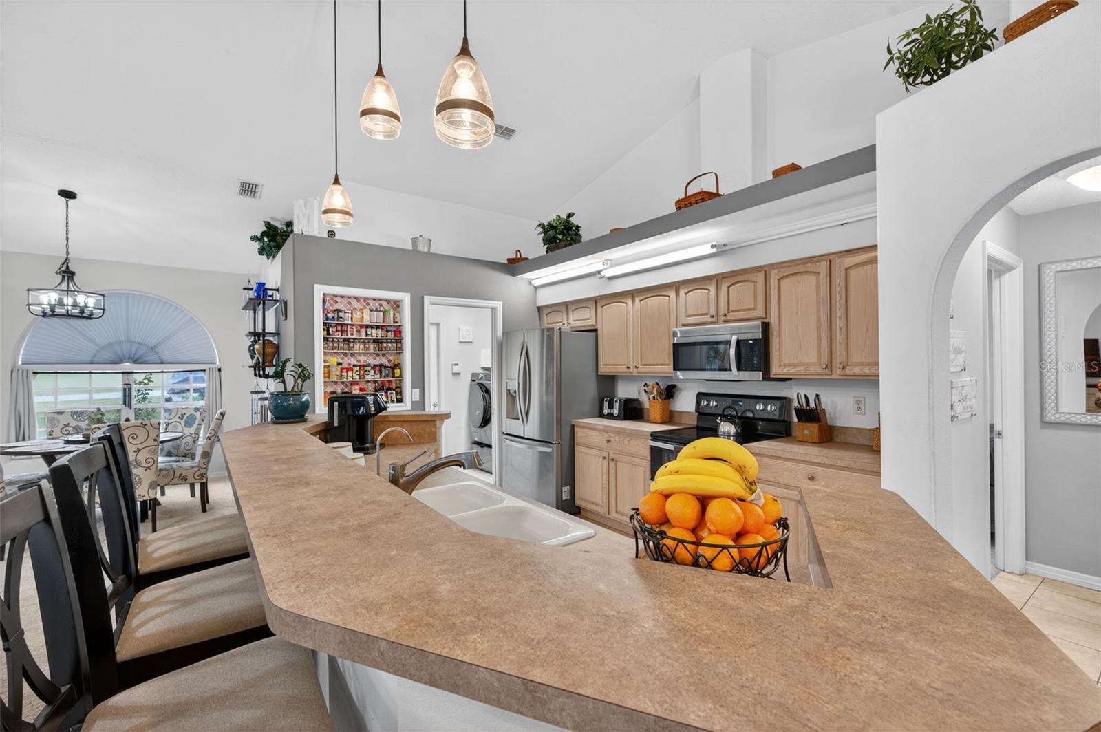 Large kitchen island opens to Living Room