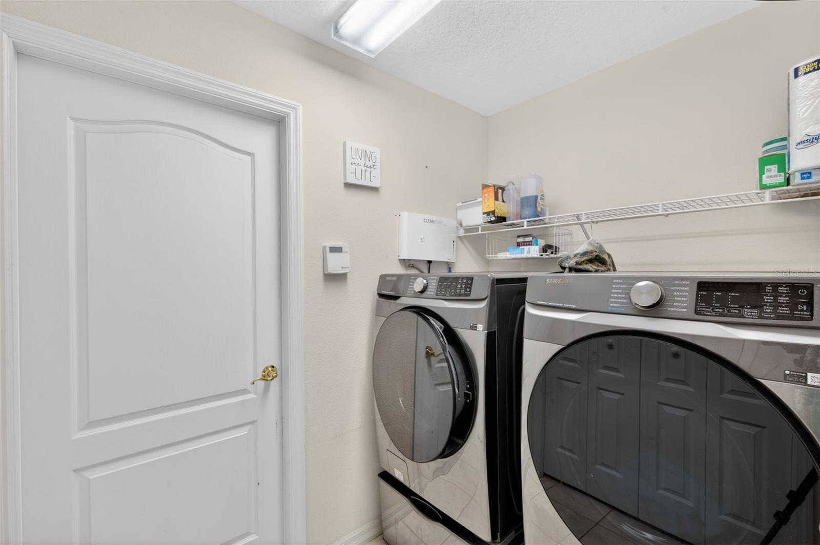 Laundry Room leading to 2-Car Garage (Pantry closet in this room across from Washer & Dryer)