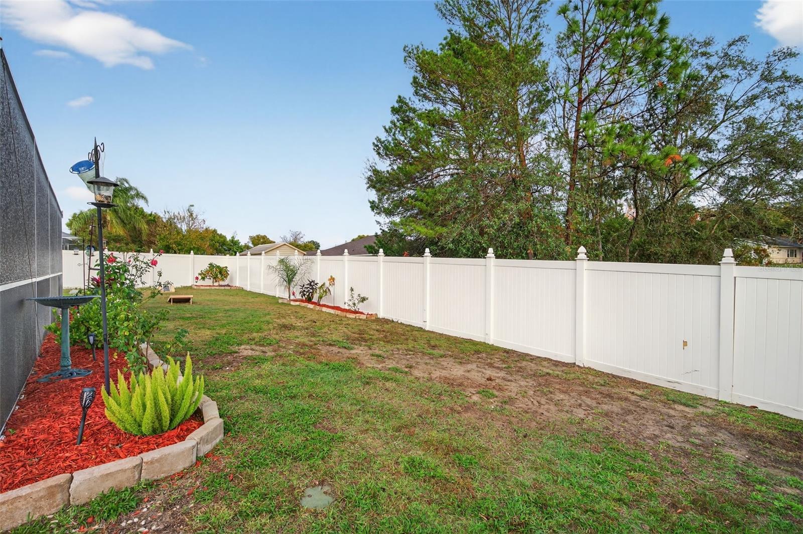 The entire Backyard has vinyl fencing.