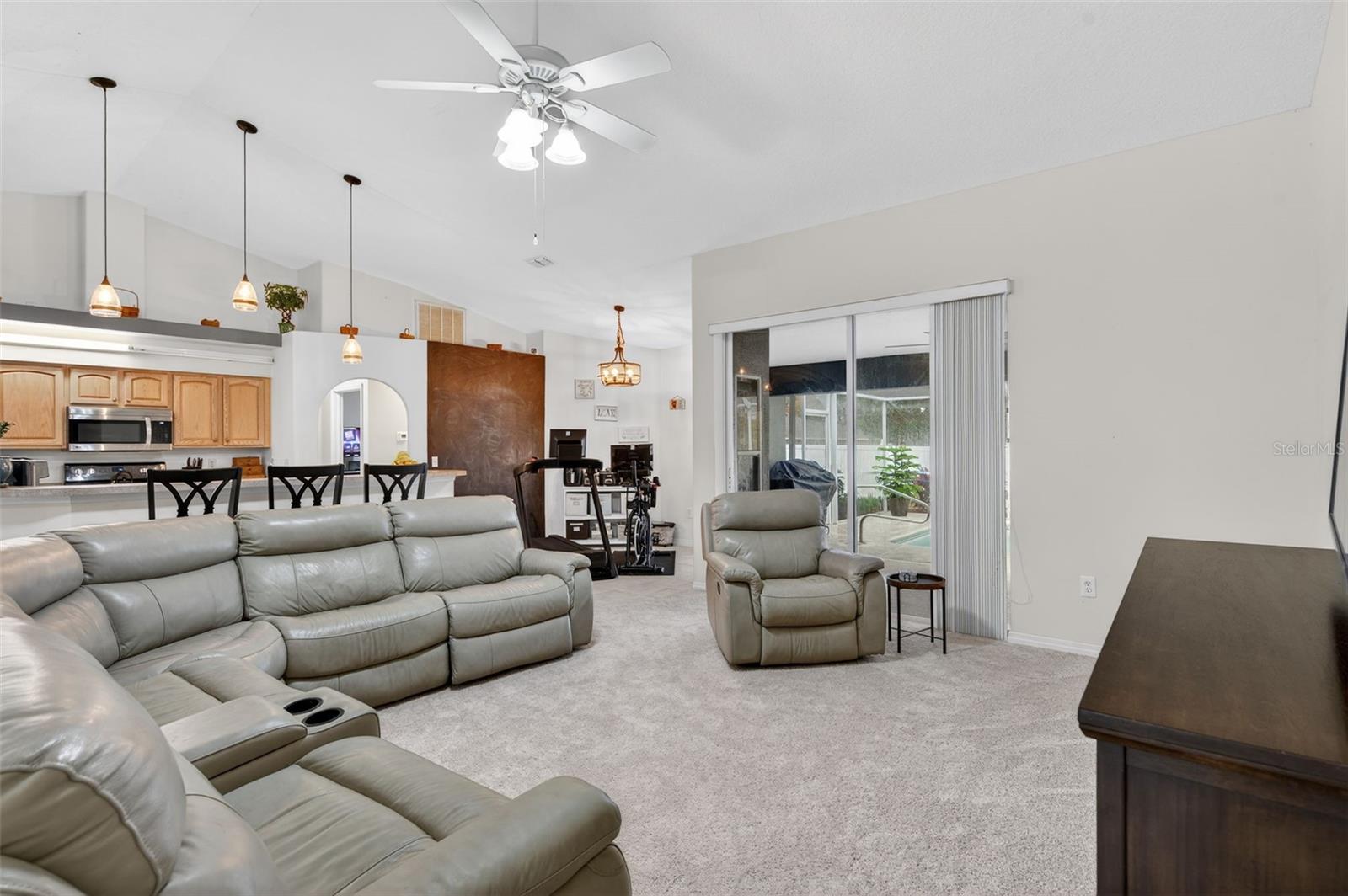 Living Room looking into Kitchen and Breakfast Nook (currently utilized as exercise an area)
