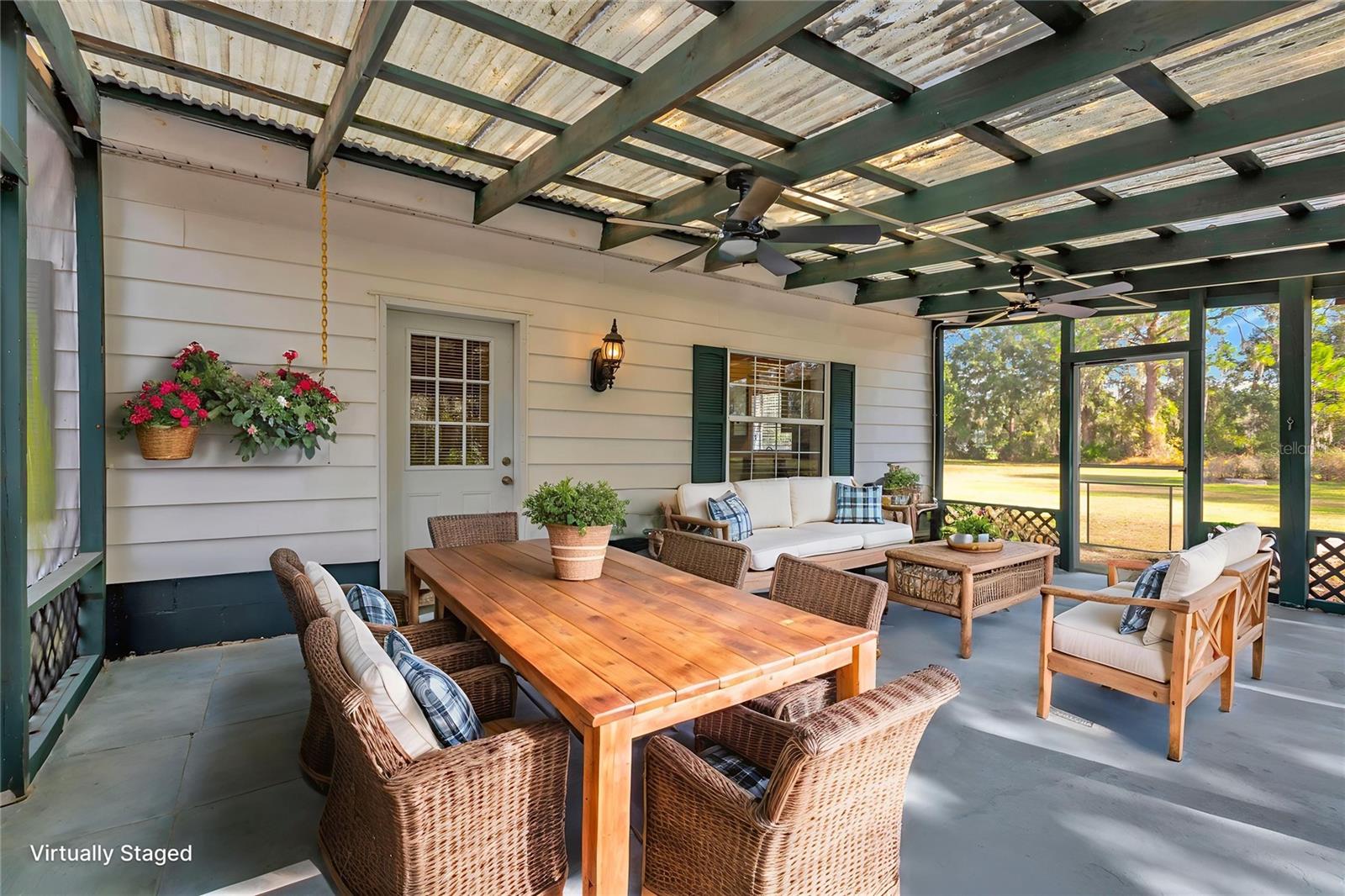 Step outside to the screened front porch to enjoy the seasonal breezes that carry the sweet aroma of nearby strawberry fields, adding to the property’s storybook charm.