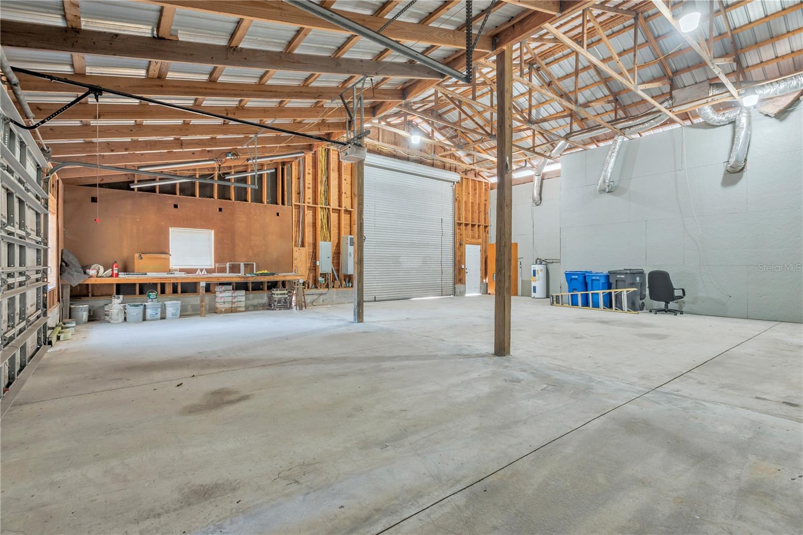 There is space to accommodate up to six vehicles or recreational toys and impressive ceiling height, the garage offers endless potential for future enhancements, including a loft or car lift.