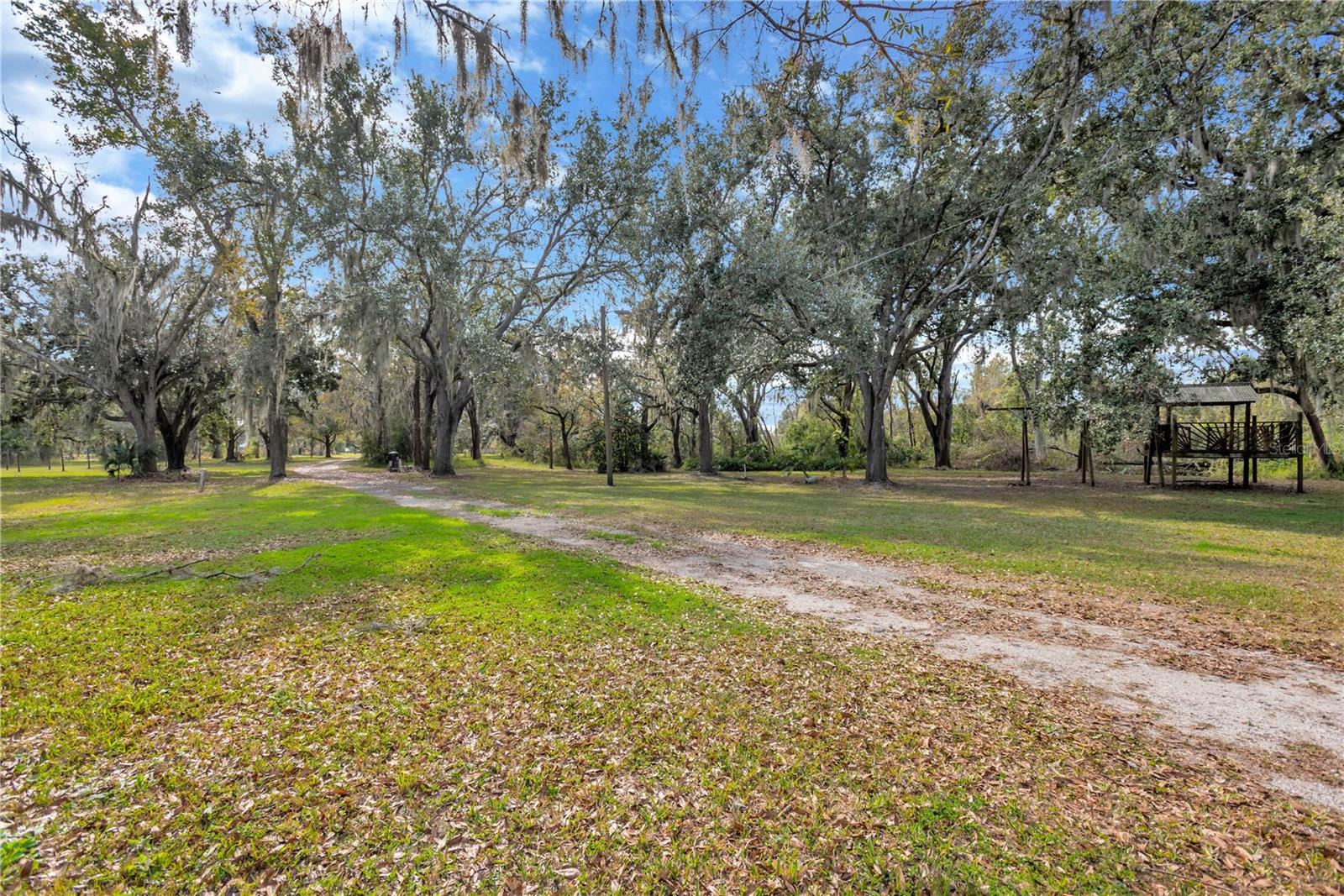 With frontage on Holloway Road with a private long tree-lined driveway.