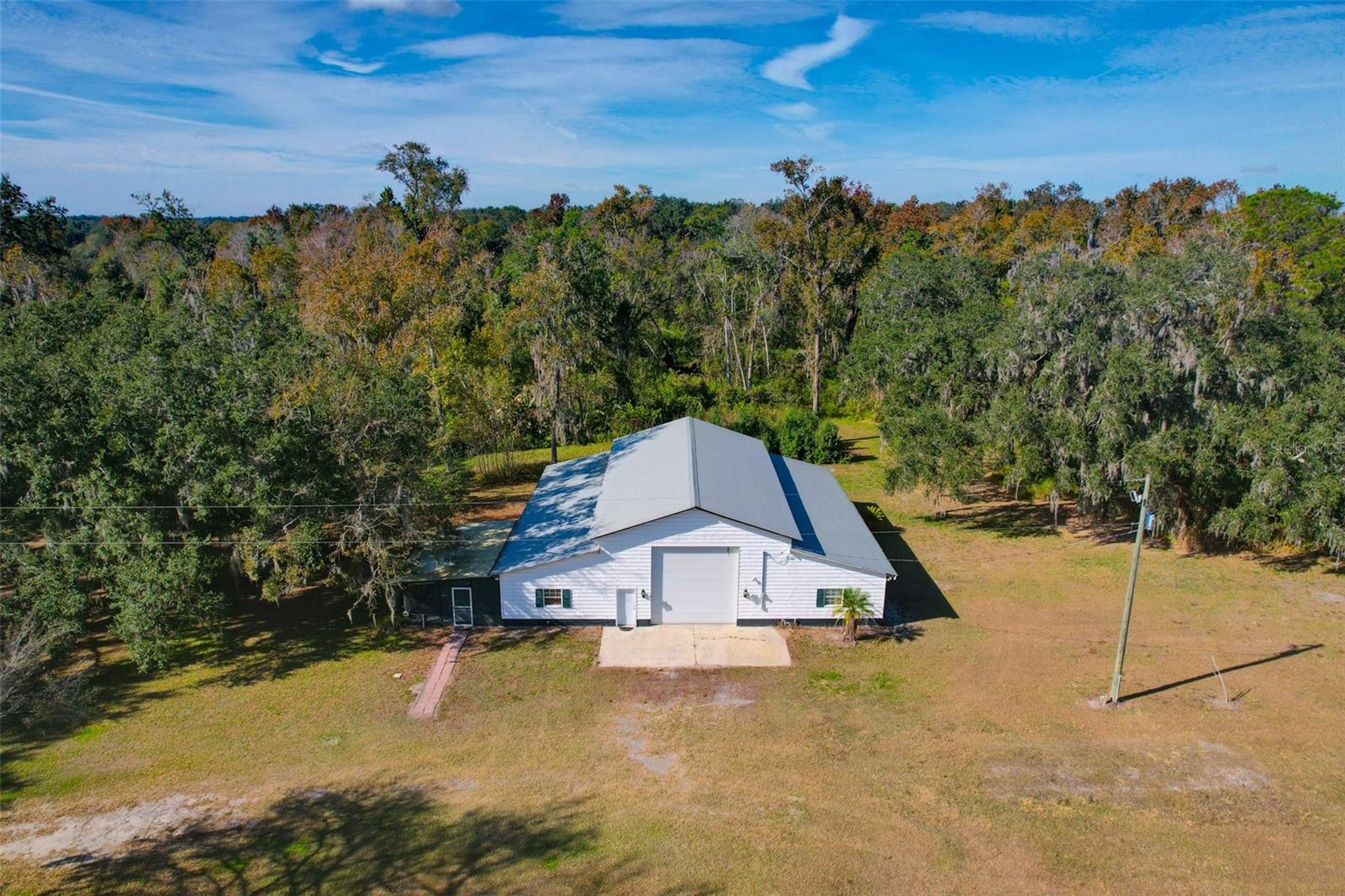 The property’s infrastructure, a legacy of its former use as a plant nursery, adds exceptional value and flexibility. It includes three septic connections and a 300+ foot deep private well.