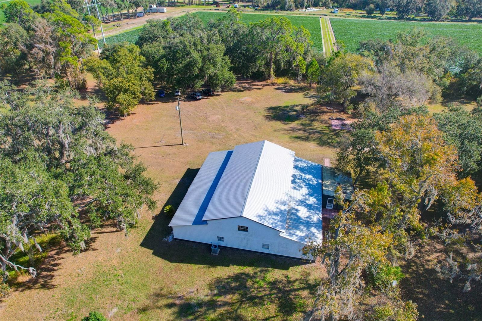 Aerial photo of home and neighboring strawberry fields looking directly east