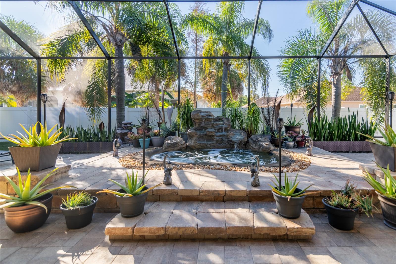 Vinyl wall in back has private gate that leads to the Clubhouse.