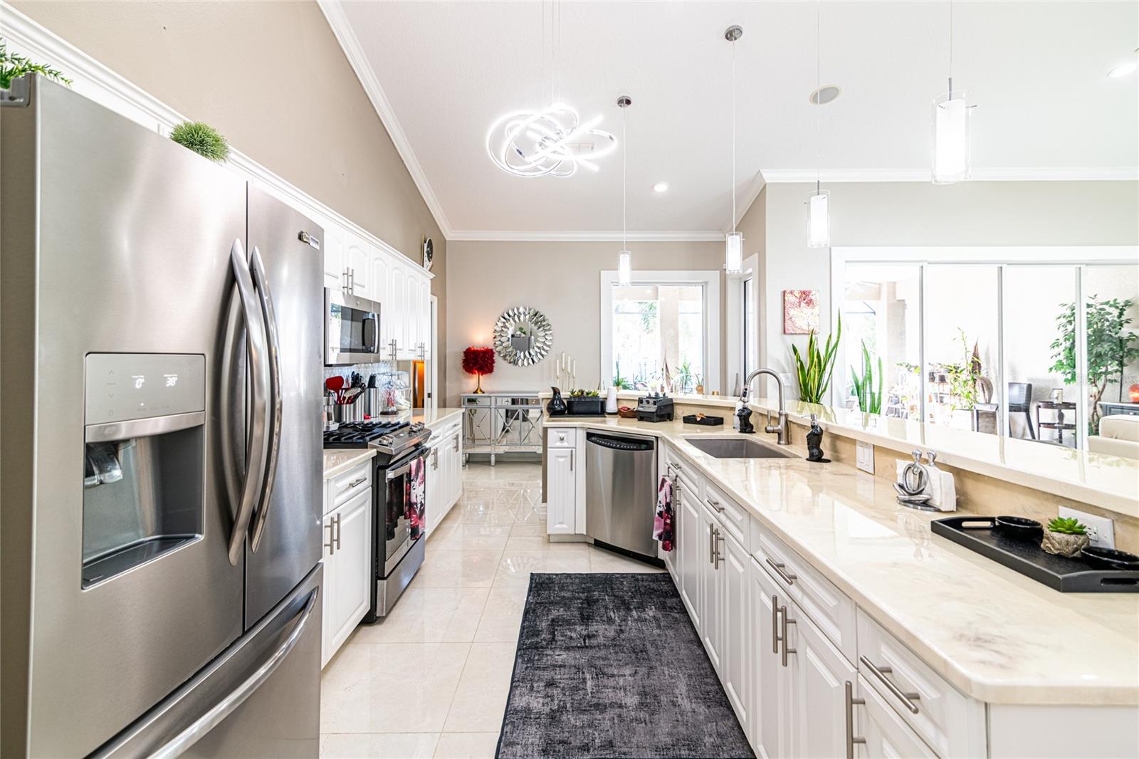 Kitchen showing cabinets, appliances and extended bar.