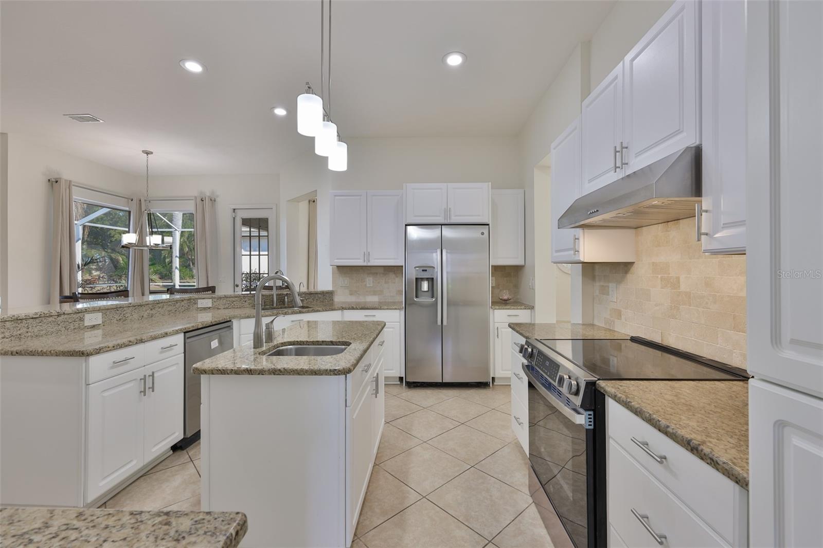 New White Wood Cabinets, Granite Countertops & Coordinating Backsplash, New SS Appliances, Fridge was Recessed