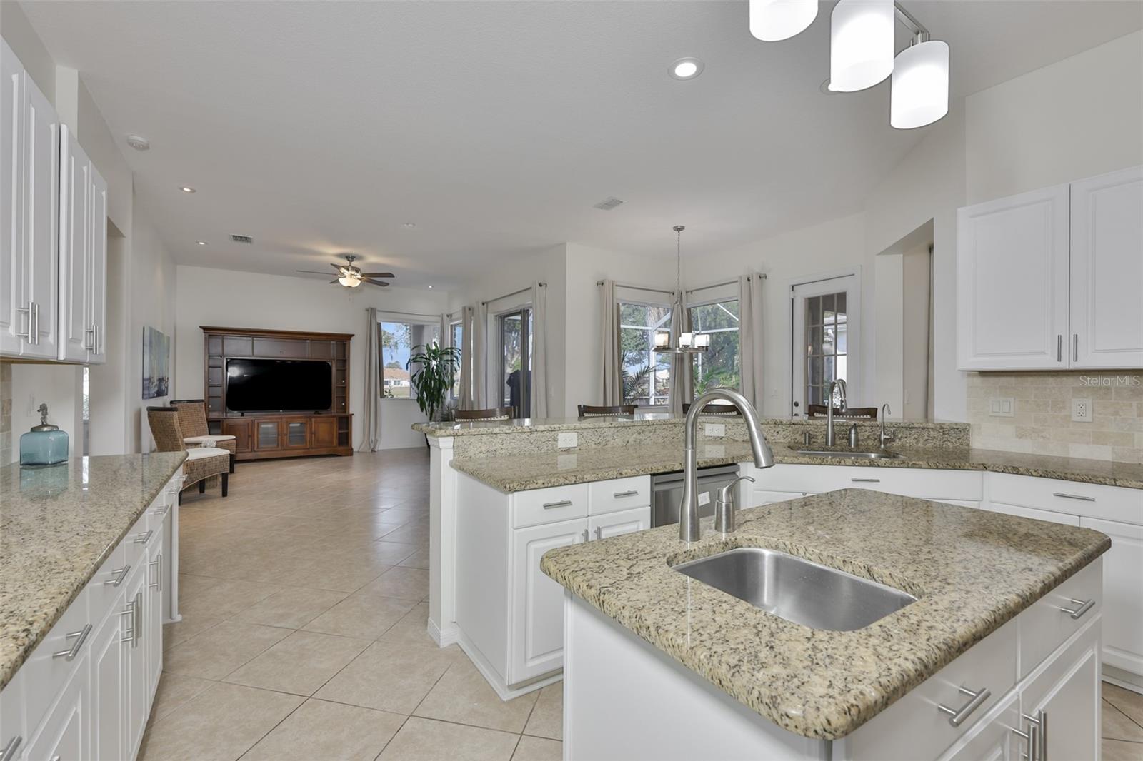 New White Wood Cabinets, Granite Countertops & Coordinating Backsplash, New SS Appliances