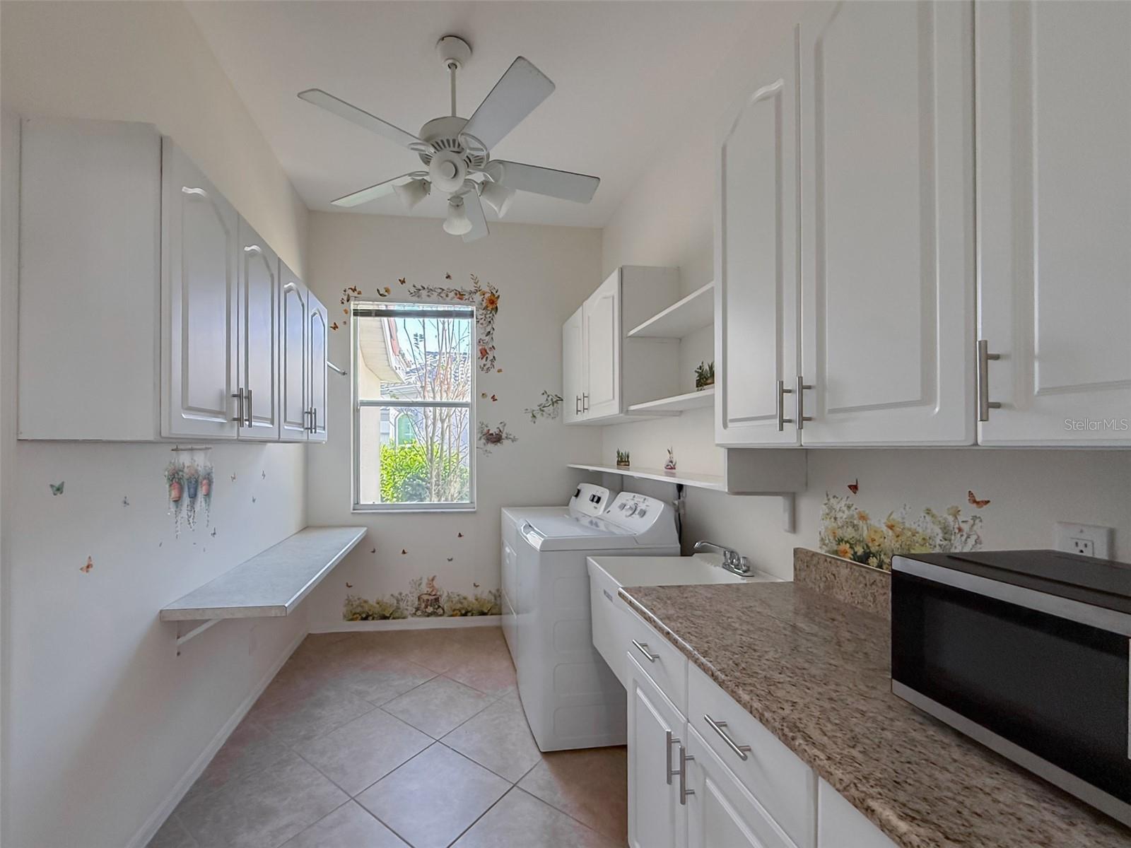 Large Laundry Room Off of Kitchen, Leading to 3 Car Garage Cabinets, Counter & Utility Sink