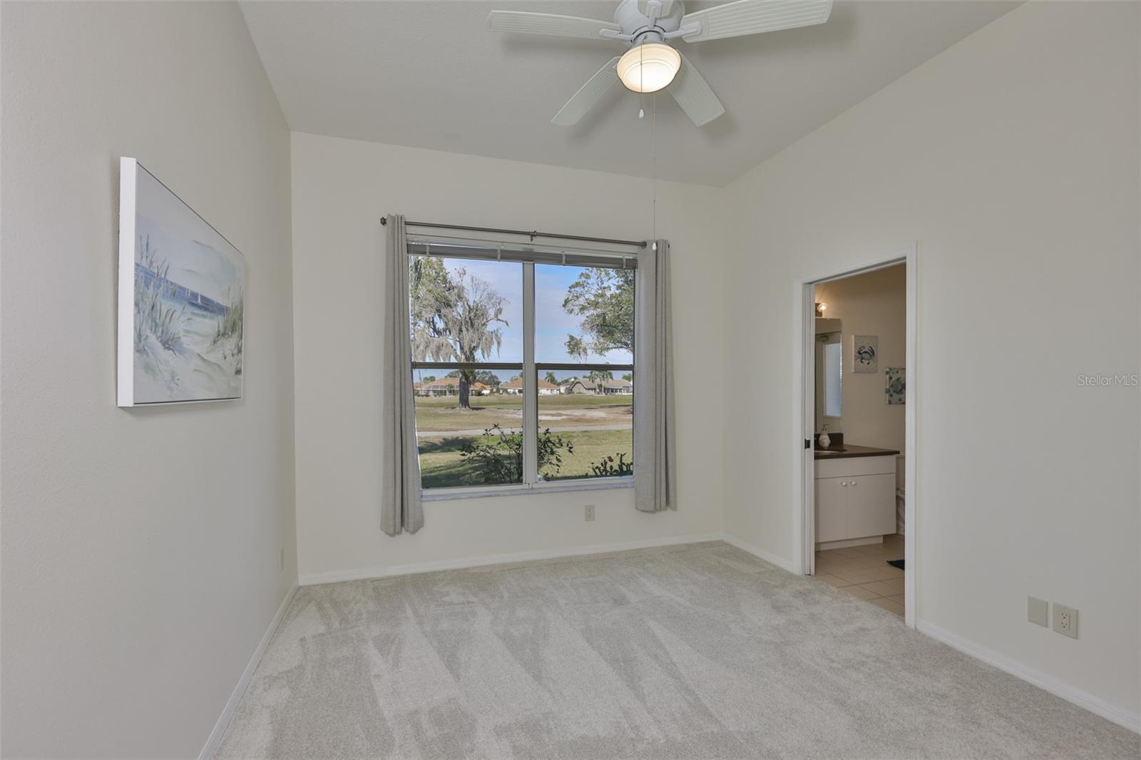 3rd Bedroom, New Carpeting, w/ Pocket Door to Ensuite 1/2 Bath & Lanai Access