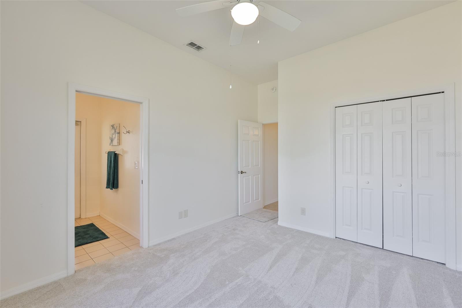3rd Bedroom, New Carpeting, w/Ensuite 1/2 Bath & Lanai Access, Extra Closet Space