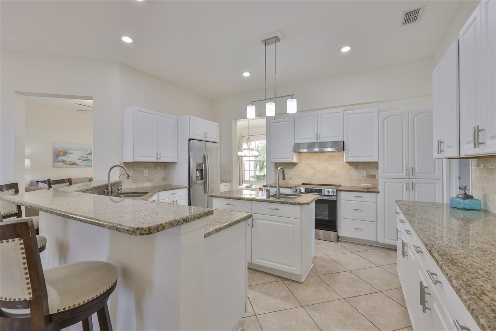Remodeled Kitchen, New White Wood Cabinets, Granite Countertops & Coordinating Backsplash, New SS Appliances, Breakfast Bar 4+ Seating