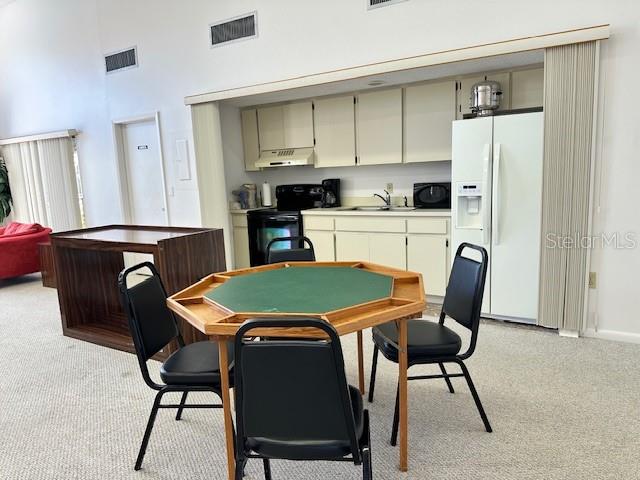 card room & kitchen area at clubhouse