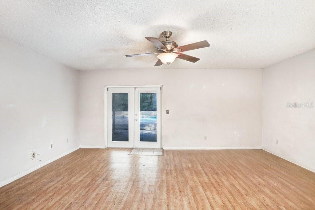 Family Room with French doors leading to pool and lanai