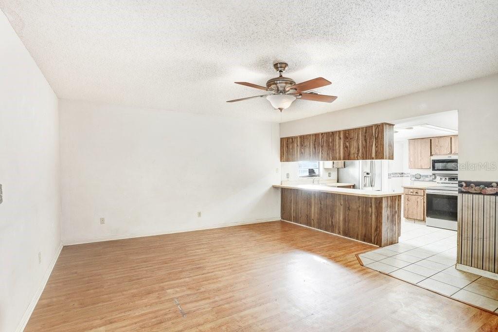 Family Room and Kitchen with French doors to Pool and Lanai