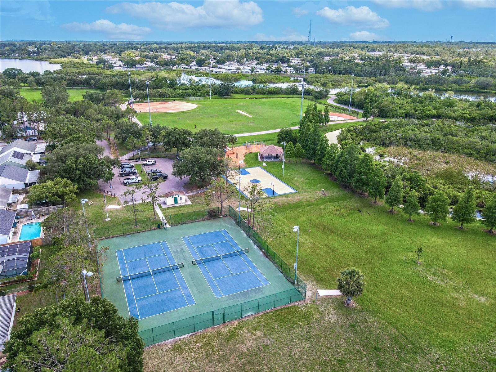 Nearby Sheffield Park offers fantastic recreation with tennis courts, playground, basketball court, picnic pavilion, and expansive fields—perfect for active weekends close to home.