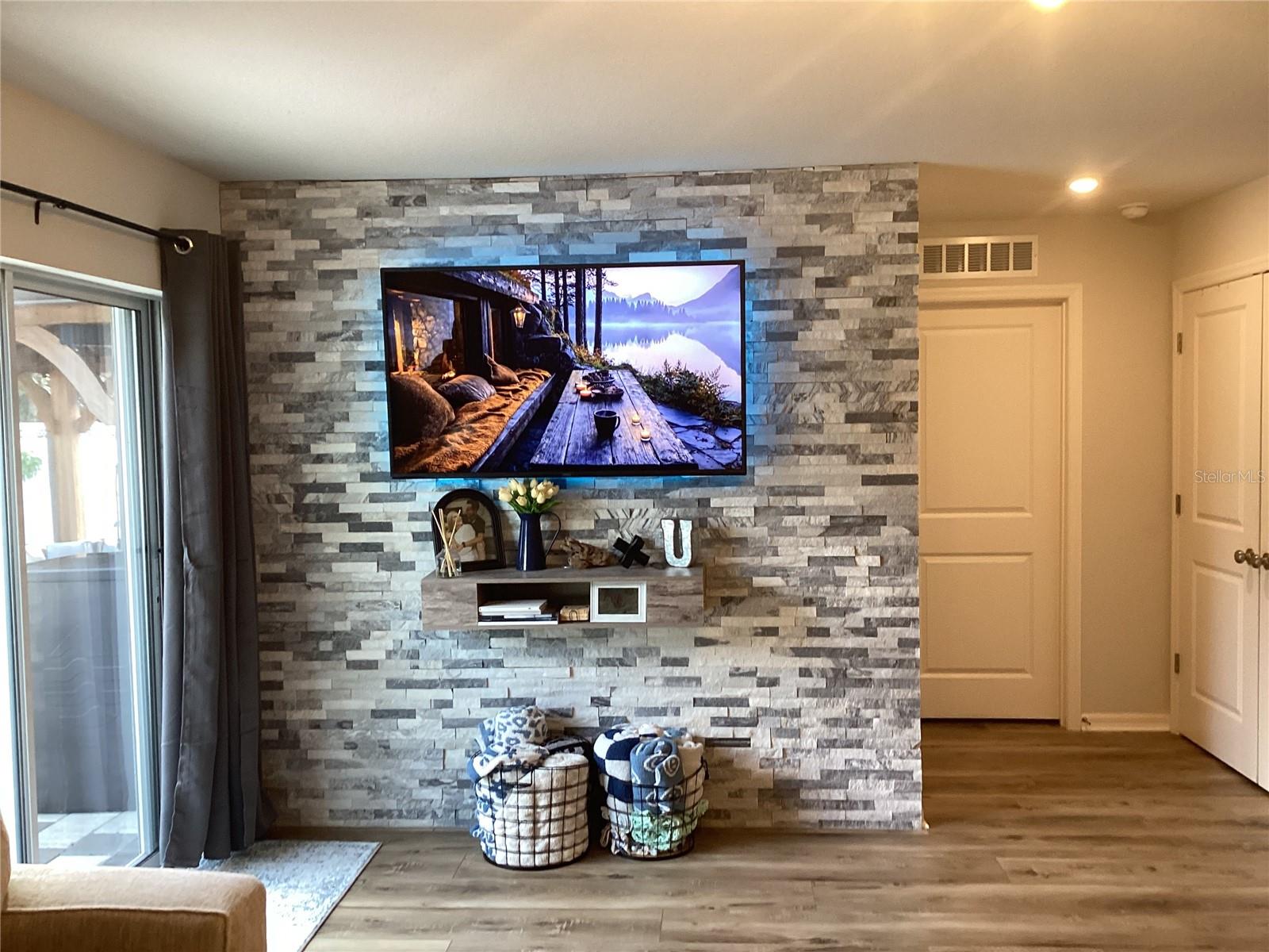 Beautiful stone accent wall in living area.