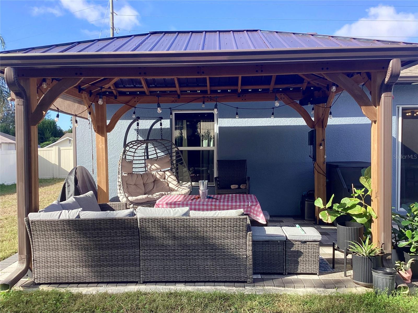 This beautiful gazebo provides shade for outdoor lounging.