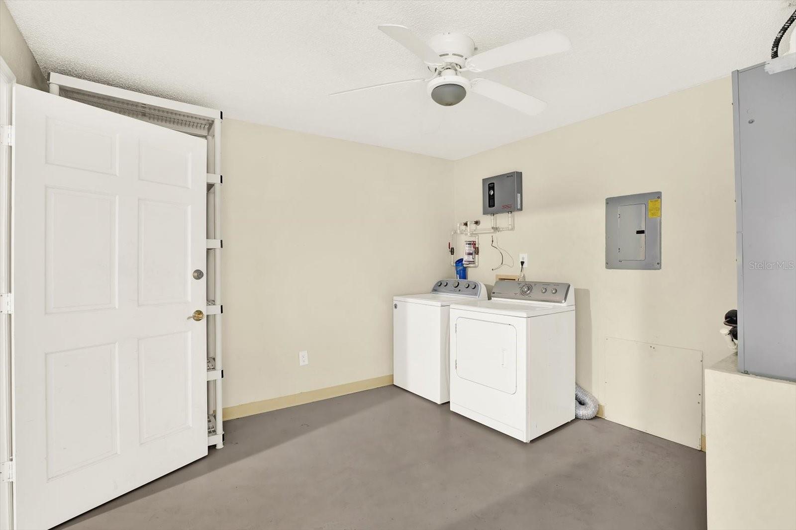Spacious FLEX space/ Laundry room on 1st level as you enter the home from the garage