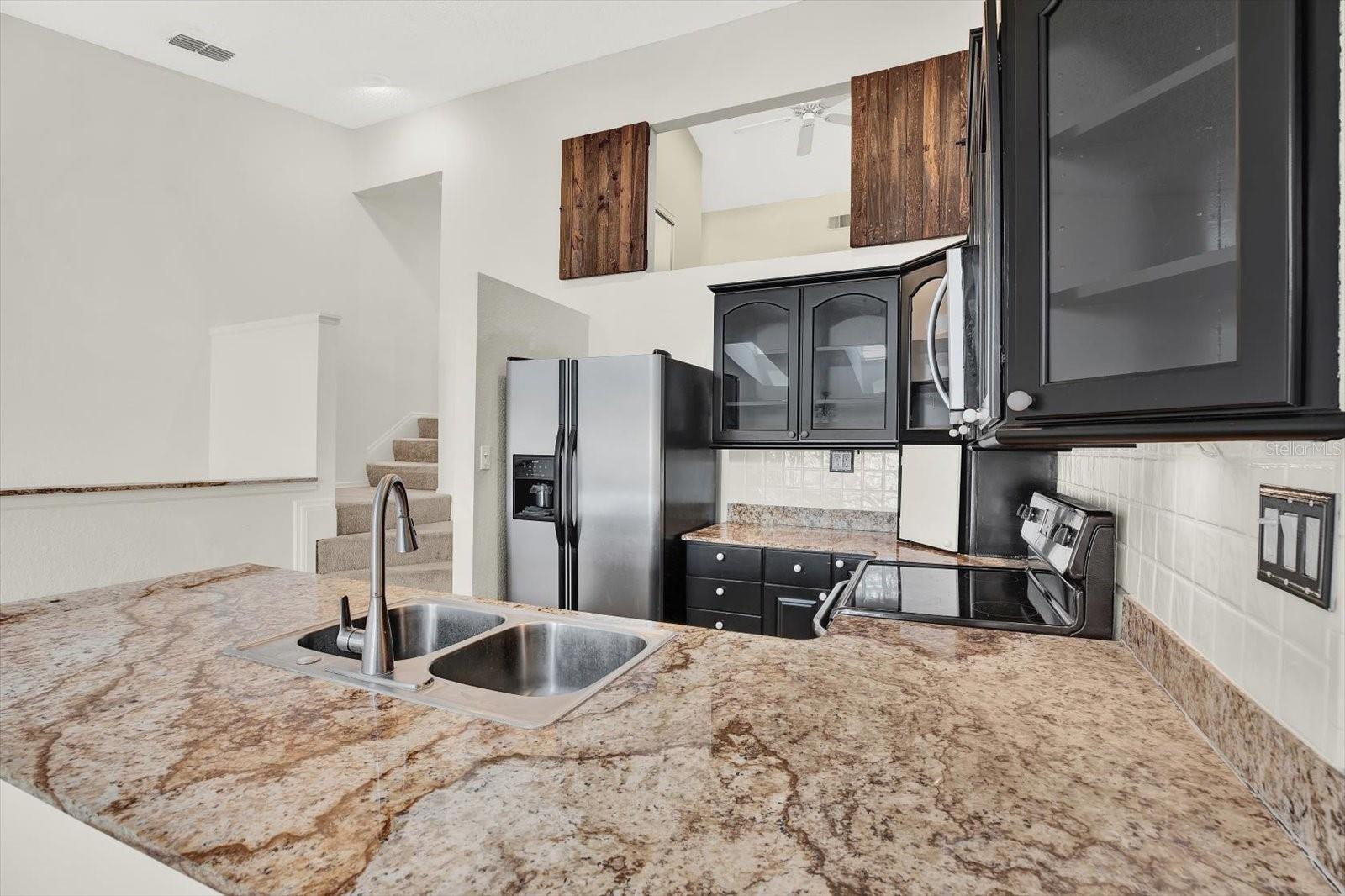 Spacious kitchen open for entertaining. Decorative granite countertops- Stainless appliances