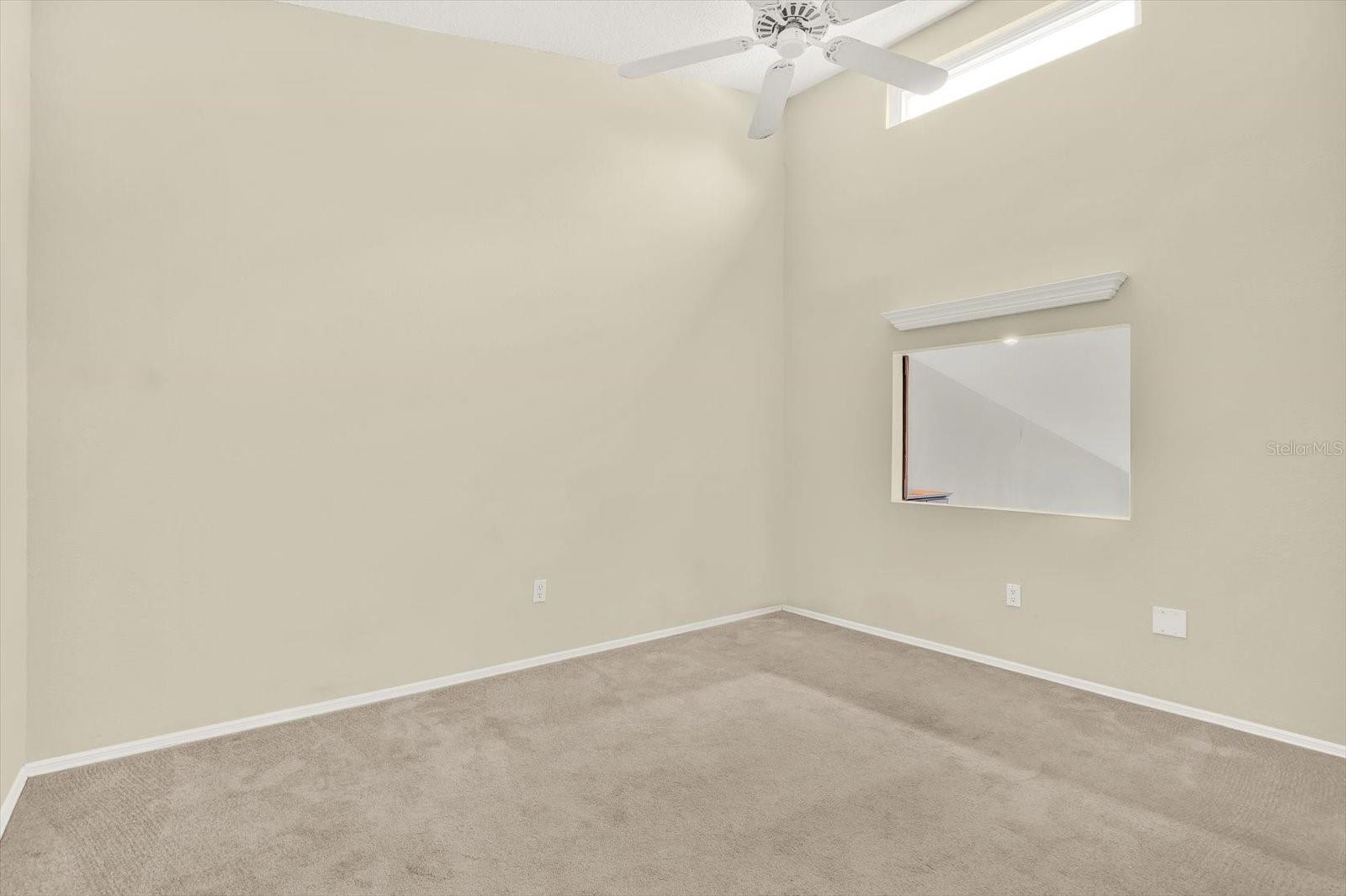 Bedroom 2 on 3rd level with high ceilings and spacious closet space
